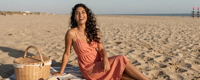 Young Latina nurse enjoying a beach picnic on a sunny afternoon