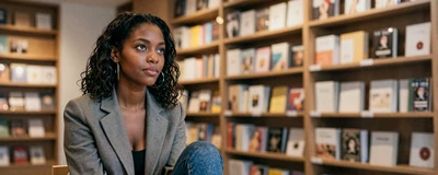 Woman healthcare professional reading in a modern bookstore