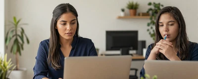 Latina medical assistant working focused at a bright modern office desk